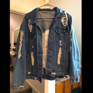 Distressed blue denim jacket